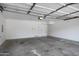 A clean, empty garage with two doors provides ample space for parking and storage solutions at 280 S Evergreen Rd # 1296, Tempe, AZ 85288