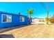 Expansive backyard featuring a palm tree, and a vibrant garden area, providing a private outdoor space at 3115 N 55Th Ave, Phoenix, AZ 85031