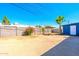 Large backyard with palm tree, block fence, and a shed for extra storage space at 3115 N 55Th Ave, Phoenix, AZ 85031