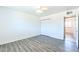 Bedroom with wood-look floors and a closet with white bi-fold doors at 3115 N 55Th Ave, Phoenix, AZ 85031