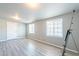 Bright living area with two windows and wood-look floors, perfect for relaxing or entertaining at 3115 N 55Th Ave, Phoenix, AZ 85031