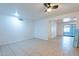 Bright living room featuring neutral tile flooring and a sliding glass door at 3115 N 55Th Ave, Phoenix, AZ 85031