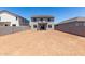 Expansive backyard, enclosed by a block fence, providing ample space for landscaping and recreation at 31822 N Bandit Rd, San Tan Valley, AZ 85143