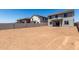 Spacious backyard surrounded by block fencing, offering endless possibilities for customization and enjoyment at 31822 N Bandit Rd, San Tan Valley, AZ 85143