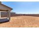 Large backyard featuring a covered patio and plenty of space for outdoor activities at 31822 N Bandit Rd, San Tan Valley, AZ 85143