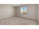Bedroom with carpet flooring and a window overlooking the neighborhood at 31822 N Bandit Rd, San Tan Valley, AZ 85143