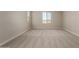 Large bedroom featuring neutral walls and carpet, with windows offering bright natural light at 31822 N Bandit Rd, San Tan Valley, AZ 85143