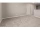 Bedroom featuring neutral carpet flooring and two doors leading to other rooms at 31822 N Bandit Rd, San Tan Valley, AZ 85143