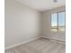 Well-lit bedroom with neutral tones, carpeted floors and a view of the neighborhood, providing a cozy atmosphere at 31822 N Bandit Rd, San Tan Valley, AZ 85143