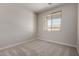 Bedroom with carpet flooring and a window overlooking the backyard at 31822 N Bandit Rd, San Tan Valley, AZ 85143