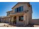Beautiful two-story home featuring a covered front porch and desert landscaping at 31822 N Bandit Rd, San Tan Valley, AZ 85143