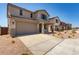 Attractive new home with a spacious driveway and low maintenance desert landscaping at 31822 N Bandit Rd, San Tan Valley, AZ 85143