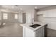 Modern kitchen with white cabinets, quartz countertops and stainless steel appliances at 31822 N Bandit Rd, San Tan Valley, AZ 85143