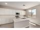 Beautiful kitchen featuring white cabinets, tile backsplash, and quartz countertops at 31822 N Bandit Rd, San Tan Valley, AZ 85143