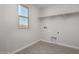 Functional laundry room with shelving, tile floor, and hookups for washer and dryer at 31822 N Bandit Rd, San Tan Valley, AZ 85143