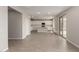 Open-concept living room and kitchen area with tile floors and recessed lighting at 31822 N Bandit Rd, San Tan Valley, AZ 85143