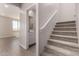Carpeted staircase leading to the second floor, with a view of the bathroom and living room at 31822 N Bandit Rd, San Tan Valley, AZ 85143