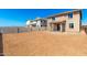 Spacious backyard featuring block wall fencing and a covered patio, perfect for outdoor living and entertaining at 31850 N Bandit Rd, San Tan Valley, AZ 85143