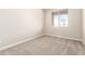 Bedroom with a large window providing natural light and carpet flooring at 31850 N Bandit Rd, San Tan Valley, AZ 85143