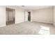 Comfortable bonus room with neutral walls, carpet flooring, and doorways to additional rooms for easy flow at 31850 N Bandit Rd, San Tan Valley, AZ 85143
