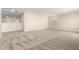 Spacious bonus room features neutral walls, carpet flooring, and an open layout for flexible design options at 31850 N Bandit Rd, San Tan Valley, AZ 85143