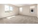 Inviting bonus room featuring carpet floors, neutral walls, and several windows providing neighborhood views at 31850 N Bandit Rd, San Tan Valley, AZ 85143
