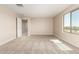 Well-lit bonus room with carpet flooring, neutral walls, and convenient access to other areas of the house at 31850 N Bandit Rd, San Tan Valley, AZ 85143