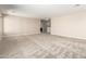 Large bonus room with neutral walls, carpet flooring, and easy access to other rooms for versatile living at 31850 N Bandit Rd, San Tan Valley, AZ 85143