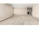 Expansive bonus room includes carpet flooring, neutral walls, and convenient access to the bathroom and other spaces at 31850 N Bandit Rd, San Tan Valley, AZ 85143