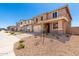 Home exterior featuring desert landscaping, two-car garage, neutral color palette, and concrete driveway at 31850 N Bandit Rd, San Tan Valley, AZ 85143