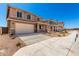 Home exterior featuring desert landscaping, two-car garage, neutral color palette, and concrete driveway at 31850 N Bandit Rd, San Tan Valley, AZ 85143