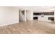 Spacious living room showcasing the staircase and the open floor plan leading to the kitchen at 31850 N Bandit Rd, San Tan Valley, AZ 85143