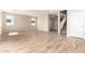 Bright living room showcasing wood-look tile floors and plenty of natural light from the windows at 31850 N Bandit Rd, San Tan Valley, AZ 85143