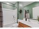 Bright bathroom features a shower-tub combo, modern vanity, and stylish decorative accents at 3597 E Henson St, San Tan Valley, AZ 85140