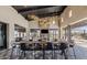 Elegant clubhouse showcasing a long table, comfortable seating, and a stunning fireplace feature at 3597 E Henson St, San Tan Valley, AZ 85140