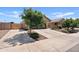 Beautiful single-story home featuring a long driveway, well-kept lawn, and mature trees at 3597 E Henson St, San Tan Valley, AZ 85140
