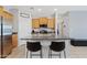 Kitchen boasts granite countertops, stainless steel appliances, a breakfast bar, and wood cabinets at 3597 E Henson St, San Tan Valley, AZ 85140