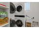 Convenient laundry area features stacked washer and dryer, plus built in storage shelves at 3597 E Henson St, San Tan Valley, AZ 85140