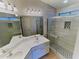 Recently remodeled bathroom with dual sinks, large mirror, and glass enclosed tiled shower at 4034 E Anderson Dr, Phoenix, AZ 85032