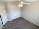 Bedroom featuring neutral walls and carpeting with sliding door closet and ceiling fan at 4034 E Anderson Dr, Phoenix, AZ 85032