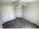 Bedroom with light gray walls and carpet, a ceiling fan, and closet with sliding doors at 4034 E Anderson Dr, Phoenix, AZ 85032