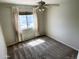 Bedroom featuring carpet, a window with curtains, and a ceiling fan with lighting at 4034 E Anderson Dr, Phoenix, AZ 85032