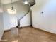 Open-concept space featuring tile floors, a staircase, and a front door with a glass panel at 4034 E Anderson Dr, Phoenix, AZ 85032