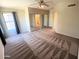 Spacious main bedroom with neutral walls, patterned carpeting, and mirrored closet doors at 4034 E Anderson Dr, Phoenix, AZ 85032