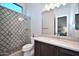 Stylish bathroom with glass shower featuring decorative tile and a modern vanity at 40613 N Candlewyck Ln, Anthem, AZ 85086