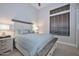 Comfortable bedroom featuring neutral tones, carpet flooring, and a bright window at 40613 N Candlewyck Ln, Anthem, AZ 85086