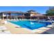 Stunning community pool with crystal clear water and plenty of seating available at 40613 N Candlewyck Ln, Anthem, AZ 85086