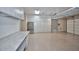 Organized garage featuring custom cabinets, work bench, and epoxy flooring, perfect for storage and projects at 40613 N Candlewyck Ln, Anthem, AZ 85086