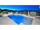 Sparkling pool with lush landscaping, offering a serene outdoor retreat at 40613 N Candlewyck Ln, Anthem, AZ 85086