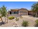Charming single-story home with well-maintained desert landscaping and a two-car garage at 4230 W Palace Station Rd, New River, AZ 85087